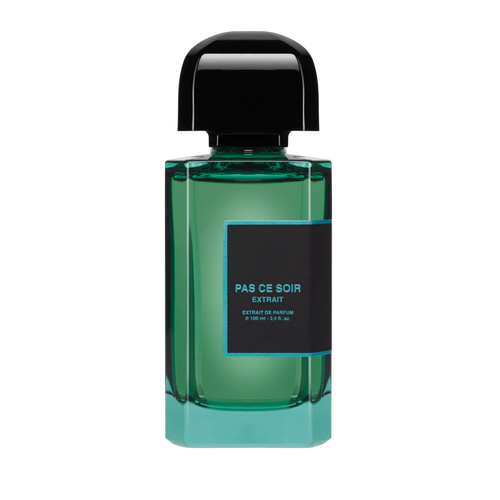 Green perfume bottle with black cap on a white background