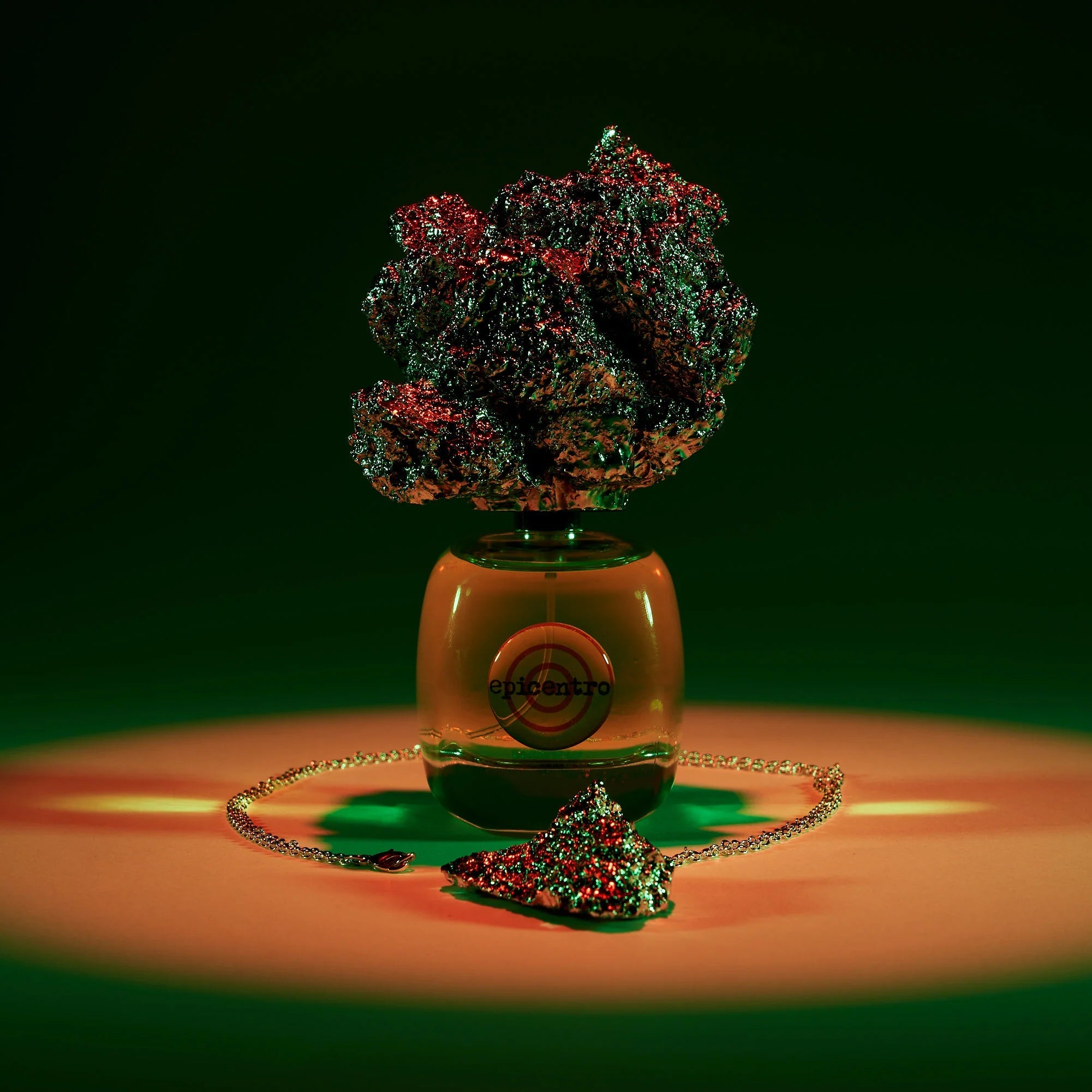 Decorative item with green and red elements on a dark background